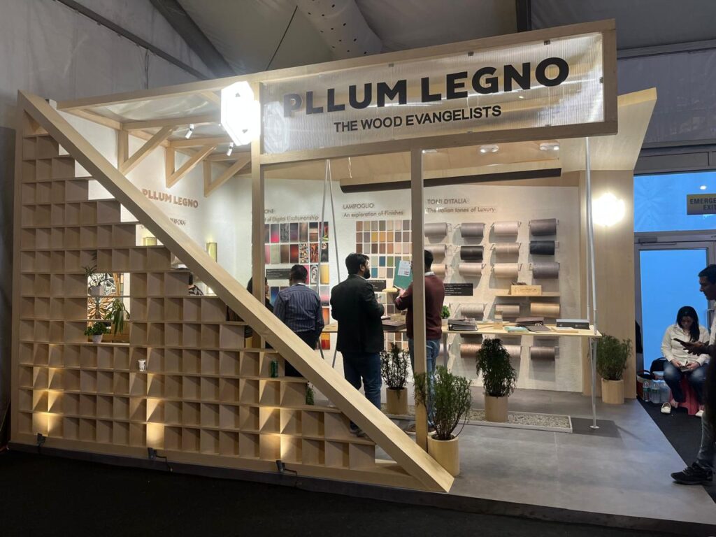 Experiential exhibition stall design in Delhi NCR featuring architectural wooden structure, immersive product display, and high-engagement brand environment for maximum visitor interaction.